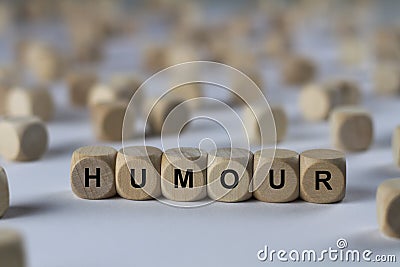 Humour - cube with letters, sign with wooden cubes Stock Photo