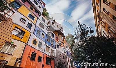 Hundertwasser house in Vienna, Austria with moving clouds Editorial Stock Photo