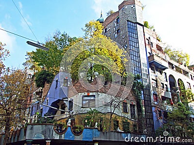 Hundertwasser House, Wien Artist`s creation of brightly painted, natural apartment block with a forested roof & balconies Editorial Stock Photo