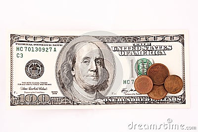 Hundred dollar bill and coins Stock Photo