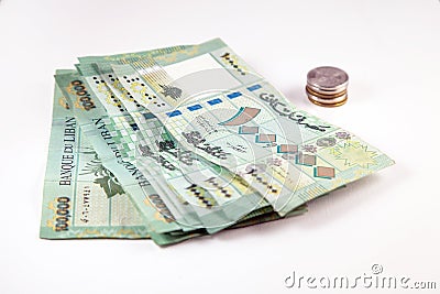 Hundred of Lebanese Pounds currency papers with Lebanon Lira Coins Stock Photo