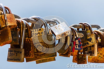 Hundreds of love locks hanging on a chain Editorial Stock Photo