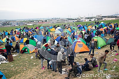 Hundreds of migrants and refugees gathered outside of a refugee camp in Diavata Editorial Stock Photo