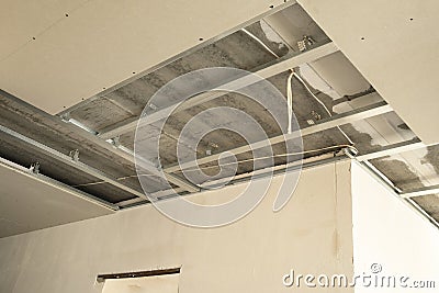 Hung drywall ceiling at construction site in apartment Stock Photo
