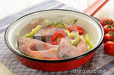 Hungarian fish pan with carp steak, paprika and thyme Stock Photo