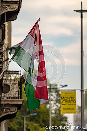 Hungarian flag with a hole in the middle as symbol of the anti-Soviet uprising in 1956 in Budapest Editorial Stock Photo