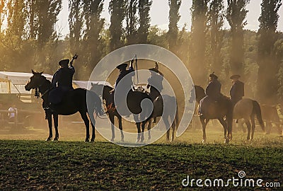 Hungarian horseman ride five horses. He wears the traditional Hungarian national costume for the horse show Editorial Stock Photo