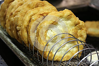 Hungarian speciality langos deep fried flat bread ready to taste Stock Photo