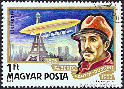 HUNGARY - CIRCA 1977: A stamp printed in Hungary shows Alberto Santos-Dumont and airship Ballon No. 5 over Paris, circa 1977. Editorial Stock Photo