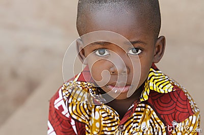 Hunger Africa Symbol - Little African Boy with Rice on Mouth Stock Photo