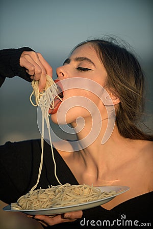 Hunger, appetite, recipe. Diet and healthy organic food, italy. Woman eating pasta as taster or restaurant critic. Chef Stock Photo