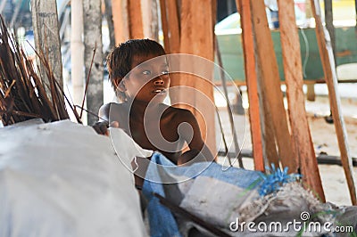 A hungry boy in Mabul Island Editorial Stock Photo