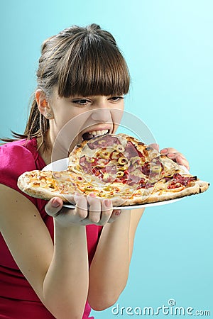 Hungry fitness instructor eating Stock Photo