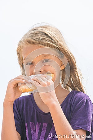 Hungry girl with an appetite for biting a delicious pie Stock Photo