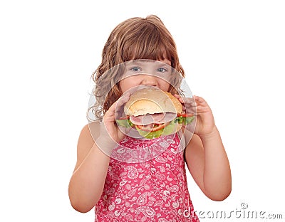 Hungry little girl eat big sandwich Stock Photo