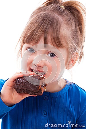 Hungry little girl eating cake Stock Photo