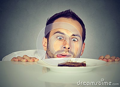 Hungry man craving sweet food Stock Photo