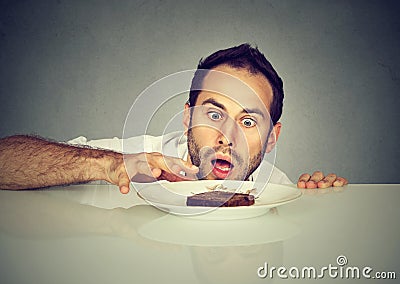 Hungry man craving sweet food Stock Photo