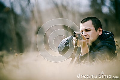 Hunter Aiming Gun Stock Photo