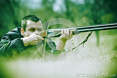 Hunter aiming Shotgun Stock Photo