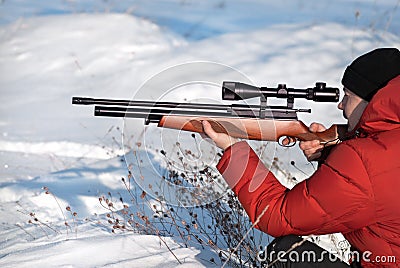 Hunter aiming with weapon Stock Photo