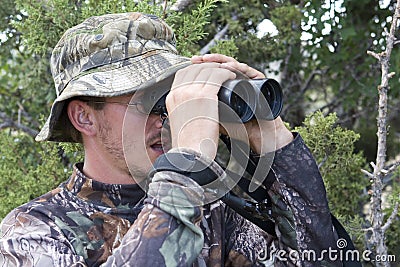 Hunter drops mouth open when he spots big animal Stock Photo