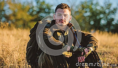 Hunter enjoy nature view. Hunting hobby leisure. Hunter satisfied with catch relaxing. Rest for real man concept. Hunter Stock Photo