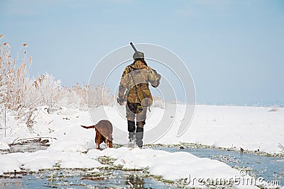Hunter with his hunting dog during a hunt Stock Photo