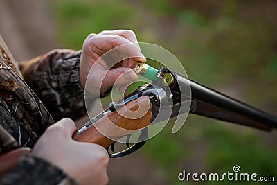 Hunter loading rifle Stock Photo