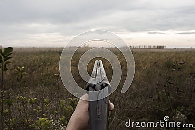 Hunter With Old Hunting Riffle Waiting for Pray in the Woods Stock Photo