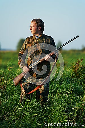 Hunter with rifle gun Stock Photo