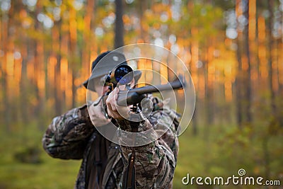 Hunter shooting a hunting gun Stock Photo