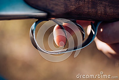 Hunter with shotgun gun on hunt. Poacher with Rifle Spotting Some Deers. Pulled the trigger of the shotgun. Big game Stock Photo