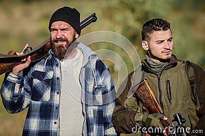 Hunters poachers looking for victim. Hunters with rifles in nature environment. Illegal hunting. Hunters brutal poachers Stock Photo