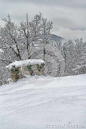 Hunting cabin in the snow Stock Photo