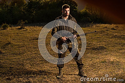 Hunting Gear - Hunting Supplies and Equipment. Hunter with shotgun gun on hunt. Hunting Gear and Hunting Clothing. Stock Photo