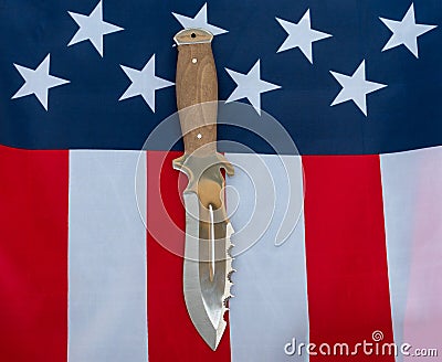 Hunting knife american flag flat lay on gray background. United States Gun Laws - Guns and weapons Stock Photo