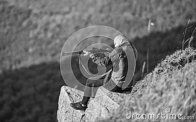 Hunting masculine hobby concept. Regulation of hunting. Focused on target. Hunter hold rifle. Hunter spend leisure Stock Photo