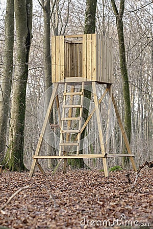 Hunting tower, wooden treehouse and observation structure in a forest or remote countryside woods. Timber wood lookout Stock Photo