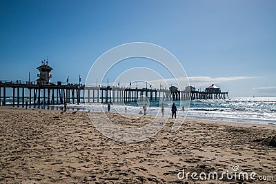 Huntington Beach, California - October 11, 2018: The Huntington Beach Pier as seen on a sunny day from a beach view looking up Editorial Stock Photo