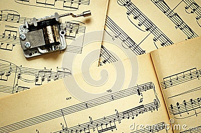 Hurdy-gurdy and music sheets Stock Photo
