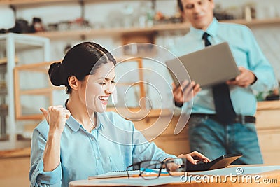 Happy woman finishing her calculations Stock Photo