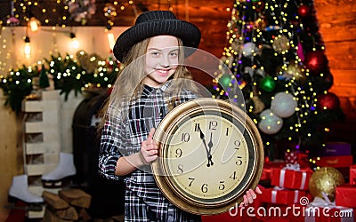 Hurry up to make wish. Girl santa claus hat and clock. Meet Christmas holiday. Festive atmosphere christmas day. New Stock Photo