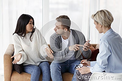 Husband Blaming Cheating Wife During Couples Therapy Session Indoor Stock Photo