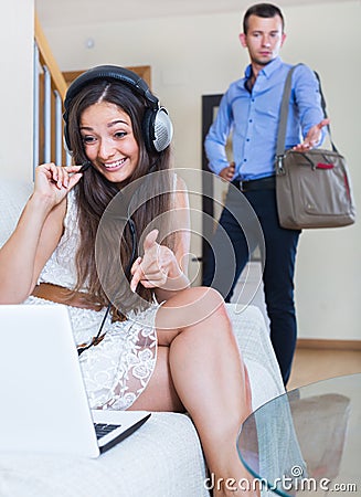 Husband blaming wife in internet addiction Stock Photo