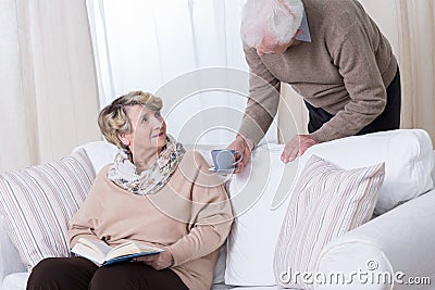 Husband caring about his wife Stock Photo