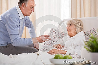 Husband caring about ill wife Stock Photo