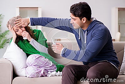 The husband caring for sick wife Stock Photo