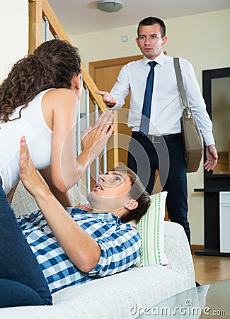 Husband catching cheating wife Stock Photo