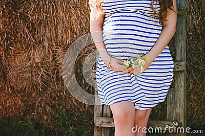 Husband hugging belly pregnant wife, love, anticipation, attitude, lifestyle Stock Photo